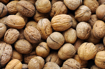 Top view of whole walnuts as background texture - 761205523