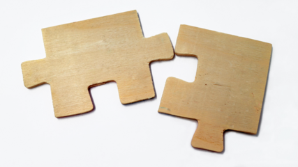 Fitting wooden puzzle pieces isolated on a white background