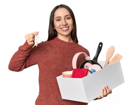 Young Caucasian woman holding moving box and keys