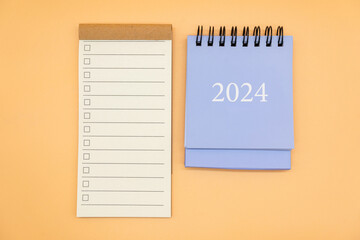 Blank to do list for text with checkbox and Simple desk 2024 calendar. Empty Check list. Copy Space. isolated background. To do list in 2024.	