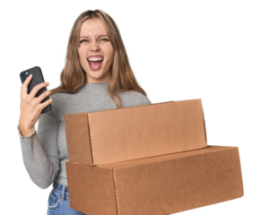 Joyful Caucasian blonde with boxes, excitedly shouting at phone news .