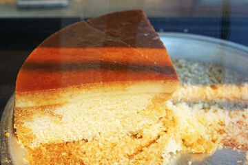 Close up slices of custard pudding cream cake