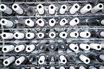 Textile industrial machine with thread spools.