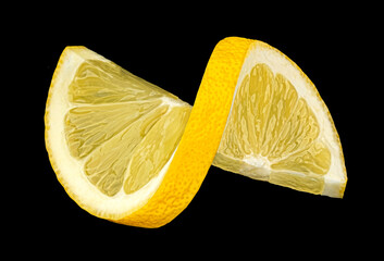 Twisted lemon slice on black background, full depth of field - 761232137