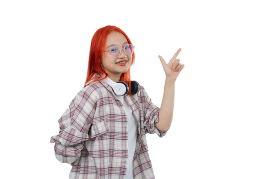 A girl with glasses and red hair is pointing to the sky. She is wearing a plaid shirt and a white t-shirt. Isolated on white background - Powered by Adobe