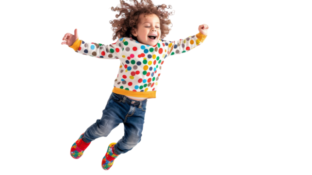 A young girl with a beaming smile jumps high into the air - Powered by Adobe