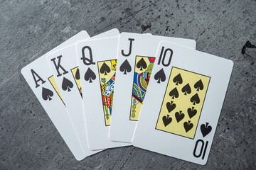 spades Royal straight flush in Poker game, playing cards with 10 J Q K A