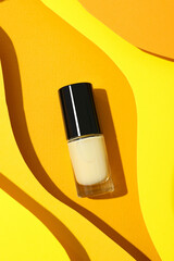 Nail polish on a voluminous yellow background