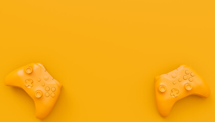 Video game joysticks or gamepads in plain monochrome yellow color background © Vasyl Onyskiv