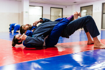 Athletes practicing martial arts at dojo
