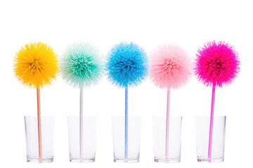 Row of Different Colored Pom Poms in a Glass. On a White or Clear Surface PNG Transparent Background.