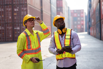 Portrait Asia logistic engineer man worker or foreman working with African American foreman with container background	 - 761260388