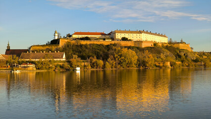 Fototapeta premium Petrovaradin Fortress by the Danube river in bright autumn day