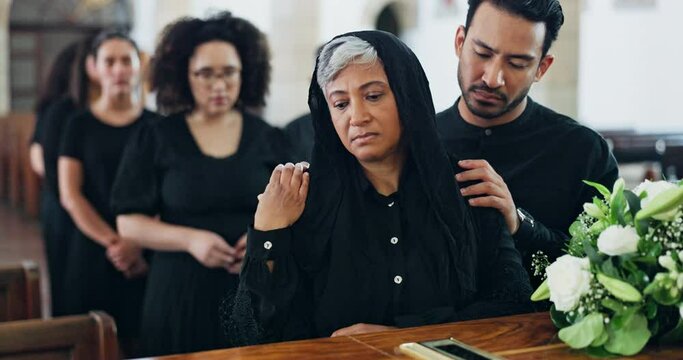 Funeral, coffin and sad woman at church, mourning or console for grief with support at ceremony together. Memorial service, casket or senior person at chapel for death, goodbye or comfort with family