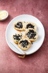 Black caviar on fresh baguette bread