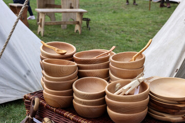 Imitations of old wooden vessels in knight camp at the festival of historical reconstruction