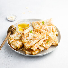 Homemade crepes with almond and honey