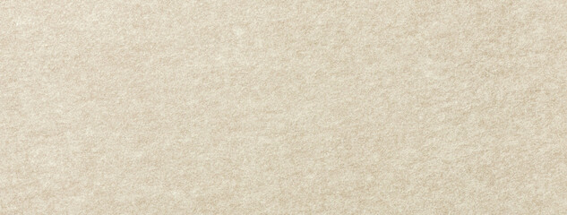 Texture of light beige color background from felt textile material, macro. Structure of vintage...