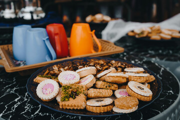 Closeup shot of various biscuits on a plate on a table in Morocco
