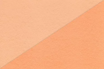 Plexiglas schilderij Pantone 2024 Peach Fuzz Texture of craft peach fuzz and coral paper background, half two colors, macro. Vintage kraft cardboard.  © nikol85