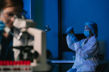 Scientist works with a pipette and a test tube. Scientific laboratory of biotechnology, development of medicine and research in chemistry, biochemistry and experiments.