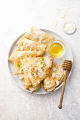 Homemade crepes with almond and honey