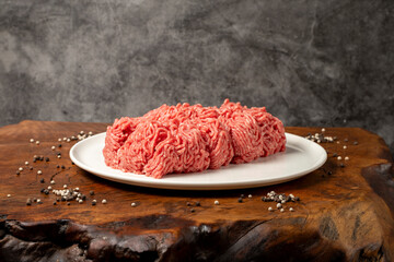 Ground beef. Butcher products. Fresh minced meat on dark background