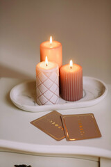 Astrology. Burning candles near astrologer cards. Tarot cards. Esoteric background. Fortune telling