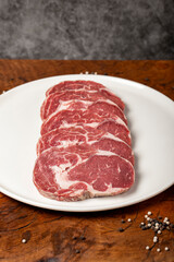 Raw beef ribeye meat. Butcher products. Fresh beef ribeye meat on dark background. Close up