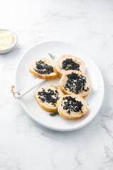 Black caviar on fresh baguette bread