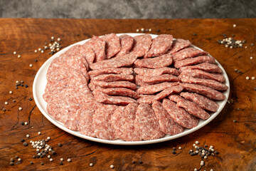 Meatballs made from raw beef mince. Butcher products. Uncooked meatballs on a dark background. Close up
