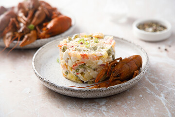Traditional Russian salad with crawfish