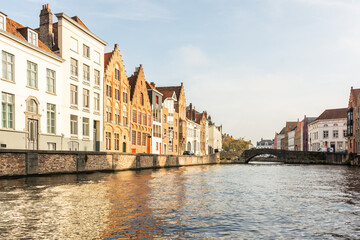 Fototapeta premium The golden hour at sunrise in the historic center of Bruges, Belgium in early autumn