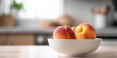 Peaches in a bowl on the kitchen table on a blurred background - 761310533