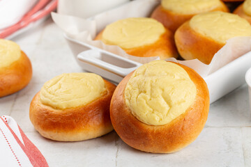 Close up of Sweet ricotta buns, homemade baked yeast pastry with filling, brioche, kalacs, or...