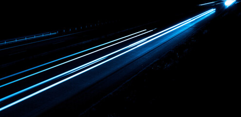 blue car lights at night. long exposure