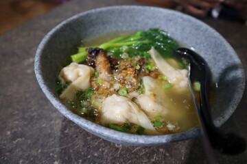 A bowl of Asian dumpling broth