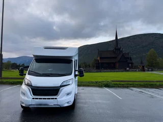 Poster Motorhome camper in Wooden church of Lom, south Norway. Europe © Alberto Gonzalez 