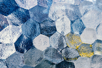 Ribbed glass surface, transparent glowing mosaic glass hexagons background