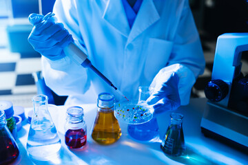 Modern medical research laboratory. female scientist working with micro pipettes analyzing...