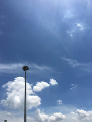 street lamp against blue sky