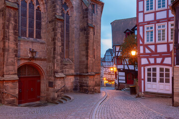Night medieval street with traditional half-timbered houses, Marburg an der Lahn, Hesse, Germany - obrazy, fototapety, plakaty