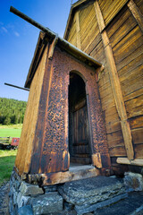 Fototapeta na wymiar Decorative door to Lomen Stave Church, Norway