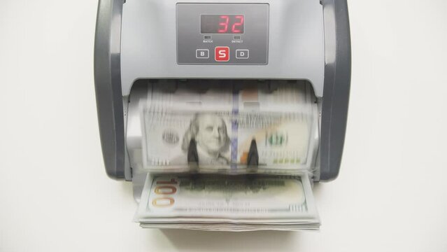 Money Counting Machine Processing US Dollar Currency