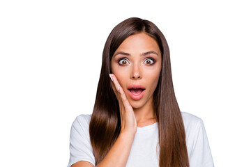 Portrait of brown-haired gorgeous nice amazed young lady showing shock with hand to cheek, opened mouth, over grey background, isolated