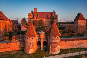 Malbork castle over the Nogat river at sunset, Poland - 761345565