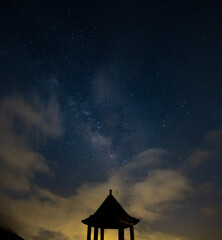 Fototapeta premium On the mountain peak a pavilion with galaxy in the sky, in Jiufen, New Taipei City, Taiwan.