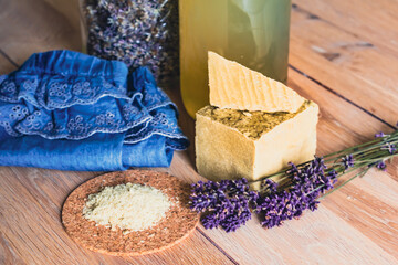 Bottles of homemade laundry on a table with lavender, Marseille grated soap, DIY, do it yourself, zero waste, eco friendly, natural product for wash and cleaning