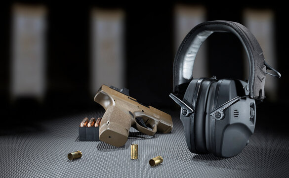 Pitol and  ammo with hearing protection