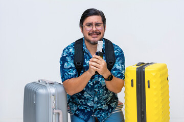 Anxious middle-aged male tourist with luggage bags, passport and boarding pass, pleading to catch...